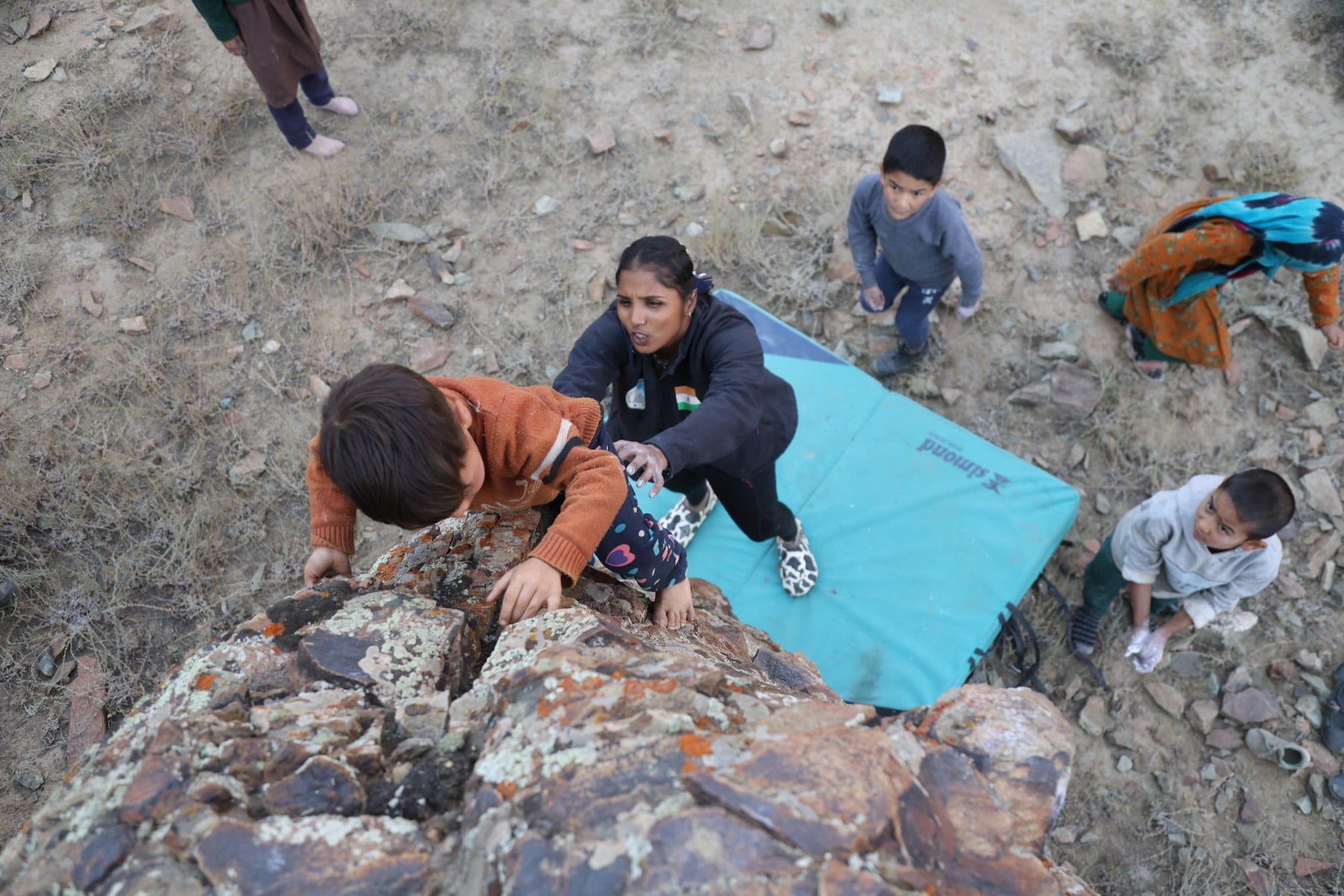 A young climber on her first boulder